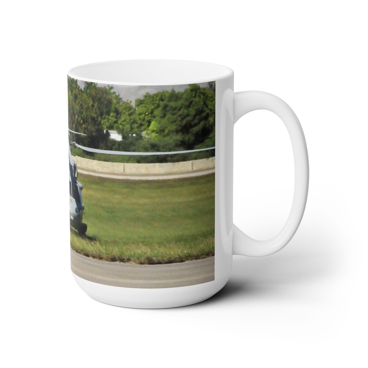 Elegant 15oz Ceramic Coffee Mug printed with a beautiful image of a grounded UH-60 Black Hawk helicopter.